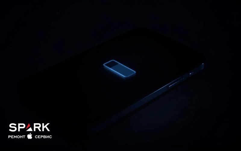 Екран iPhone у темряві зі світним значком батареї, зарядженої приблизно наполовину